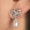 Freshwater Pearl And Bow Stud Earrings In Silver -King Louie Shop 242308 Lovely 47432 Earring Silver Pearl Bow 230509 404 category